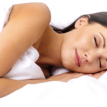 Woman sleeping on 7.5 Queen Memory Foam Mattress Topper from MLILY