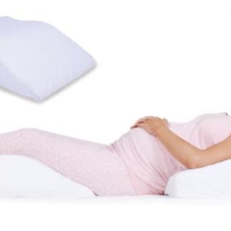 Pregnant woman using the Leg Relaxer Pillow available online or in-store at The Back and Neck Bed Shop