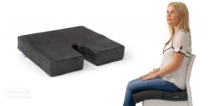 Woman sitting on the Diffuser Memory Foam Cushion available online and in-store at The Back and Neck Bed Shop