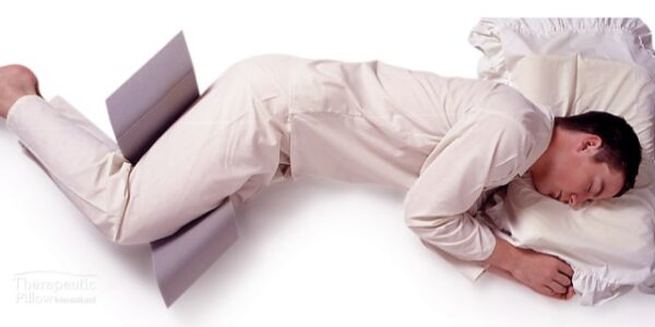 Man using the Side Sleeper Snoring Relief Leg Support available online and in-store at The Back and Neck Bed Shop