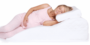 pregnant woman lying on a side reliever wedge body pillow